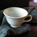 A minty green tea cup hand delivered by artist Layne Jackson (laynejackson.com)